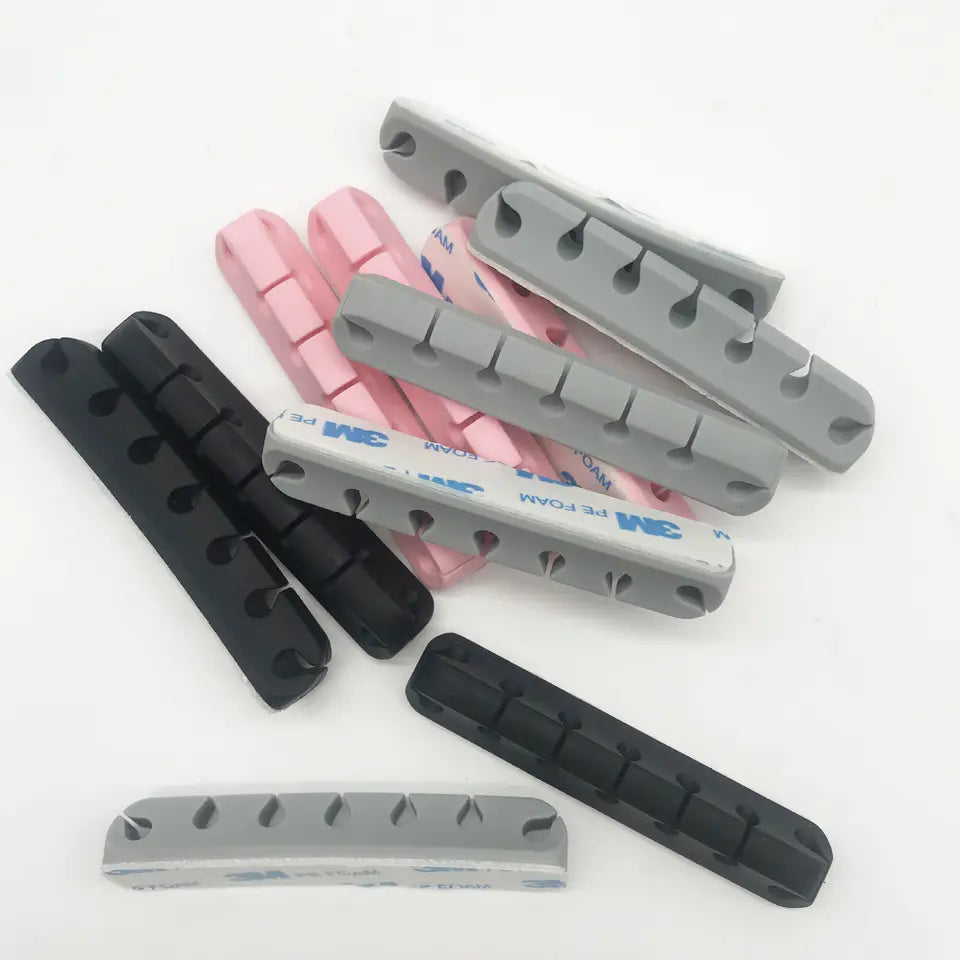 Organizador de Cables | 7 Slots | Silicona / Con Cinta Autoadhesiva | Negro / Rosado / Gris | CCE-ORG-01